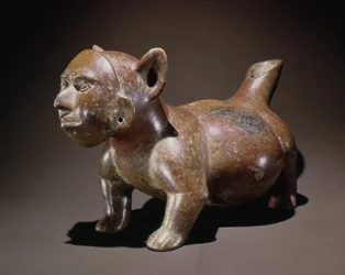 Effigy vessel representing a dog wearing a mask in the form of a human face, Colima style